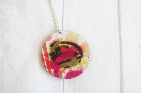 Colorful circular pendant on a white background