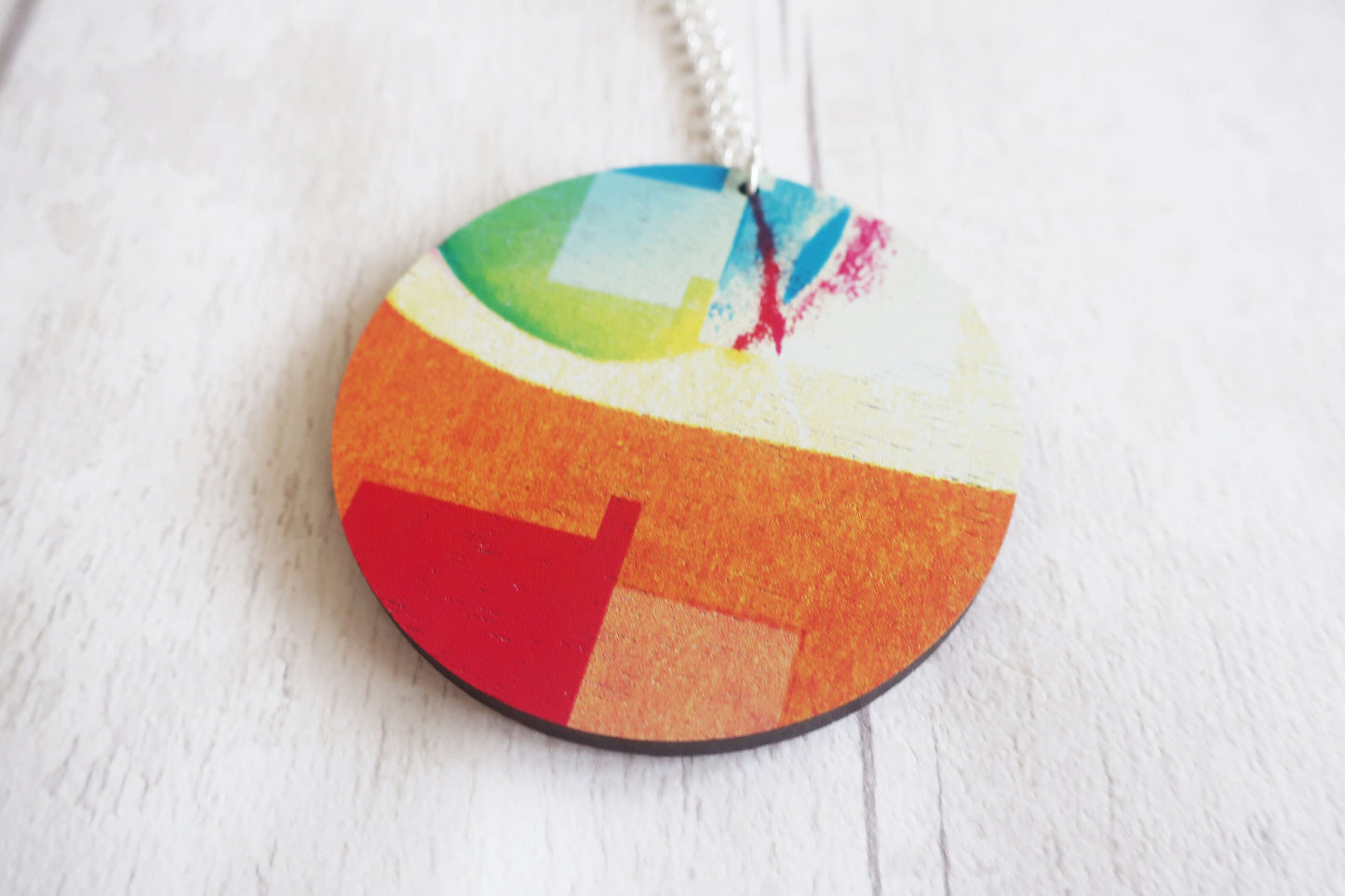 Colorful circular pendant on a white background