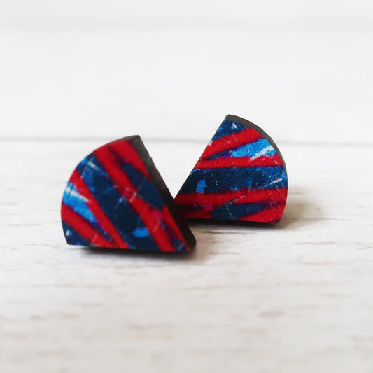 Triangular earrings with red and blue pattern on a white background