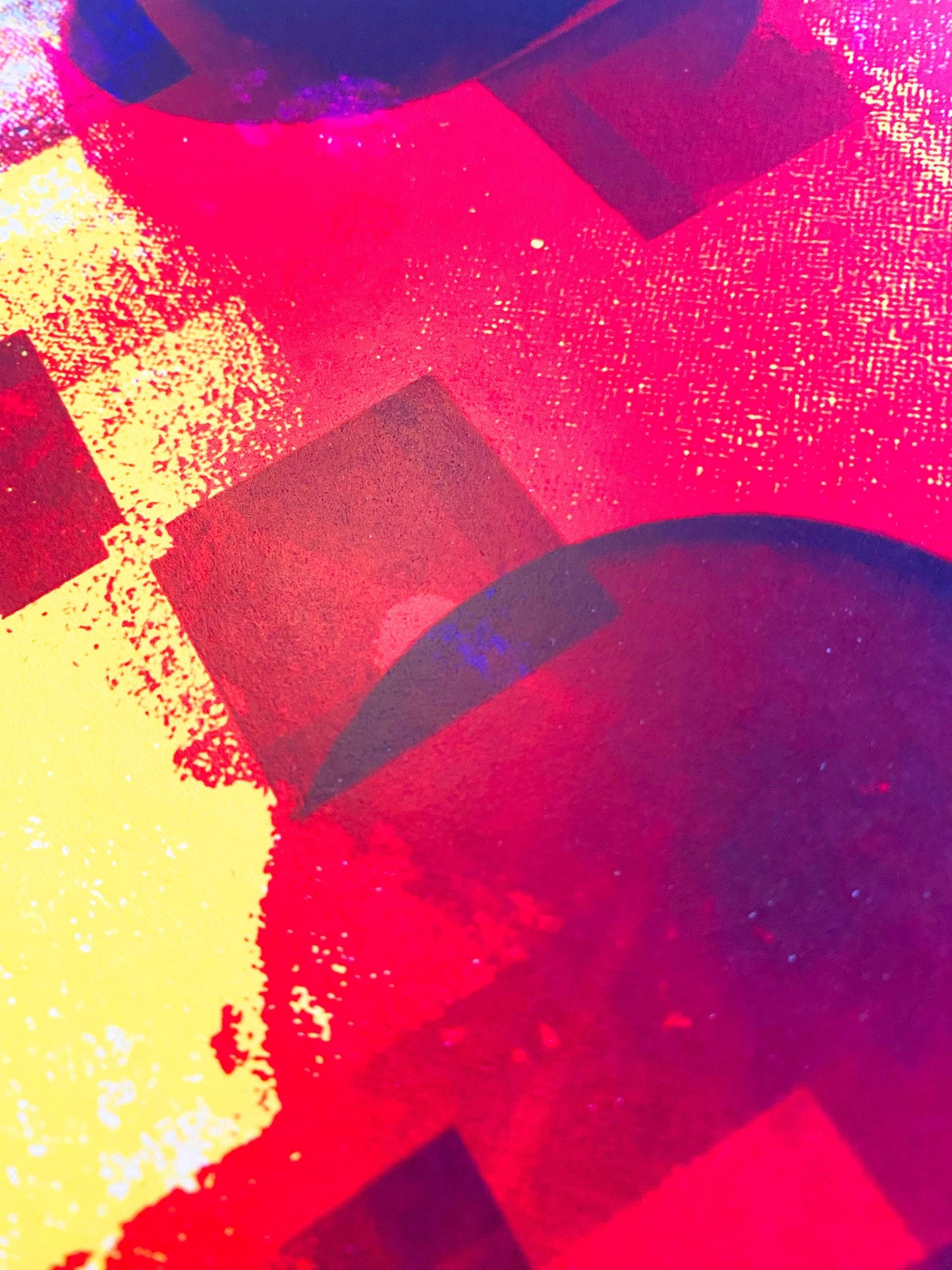 Abstract art with geometric shapes in red, yellow, and black on a textured background