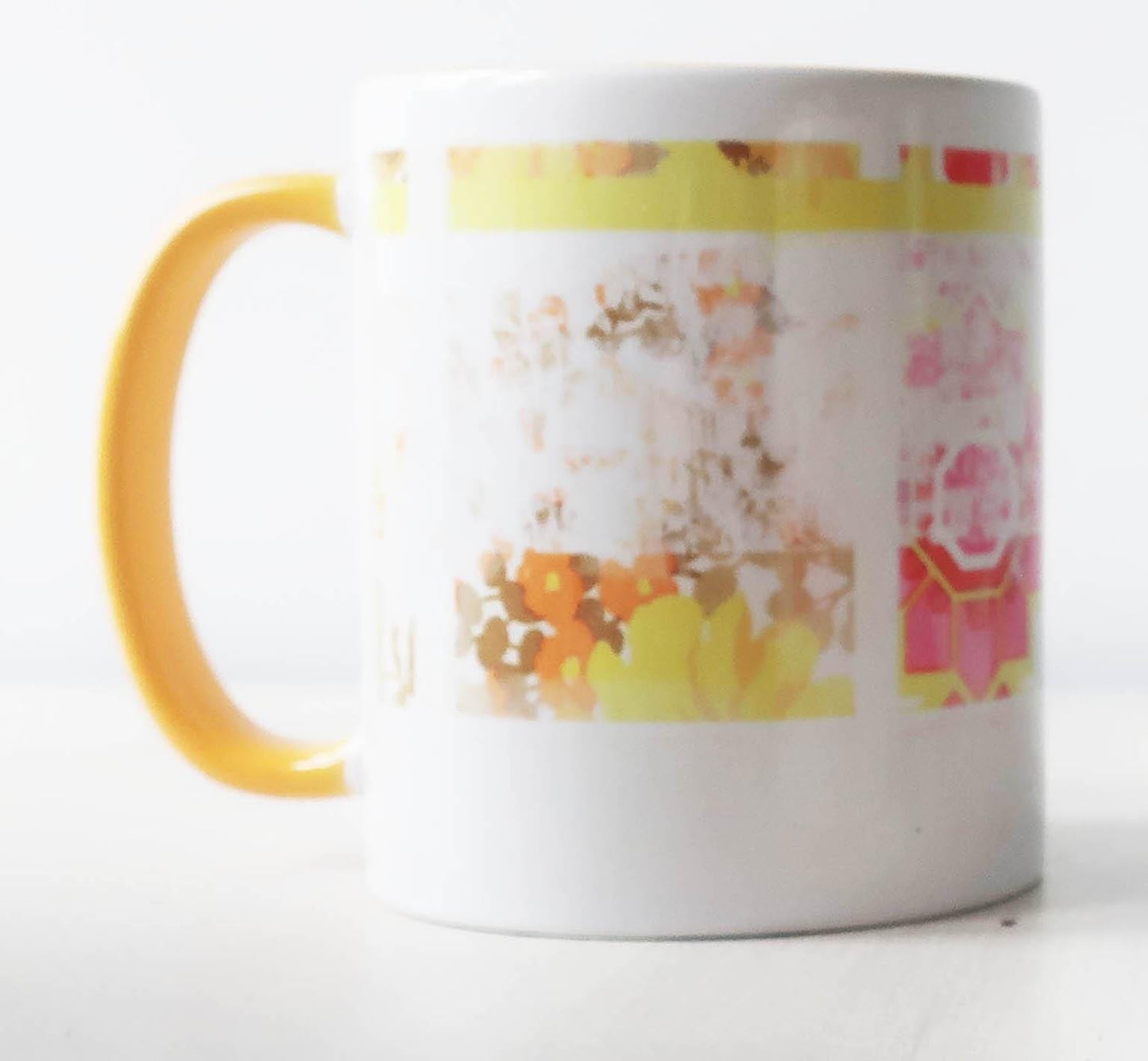 White mug with a colorful floral pattern on a white background