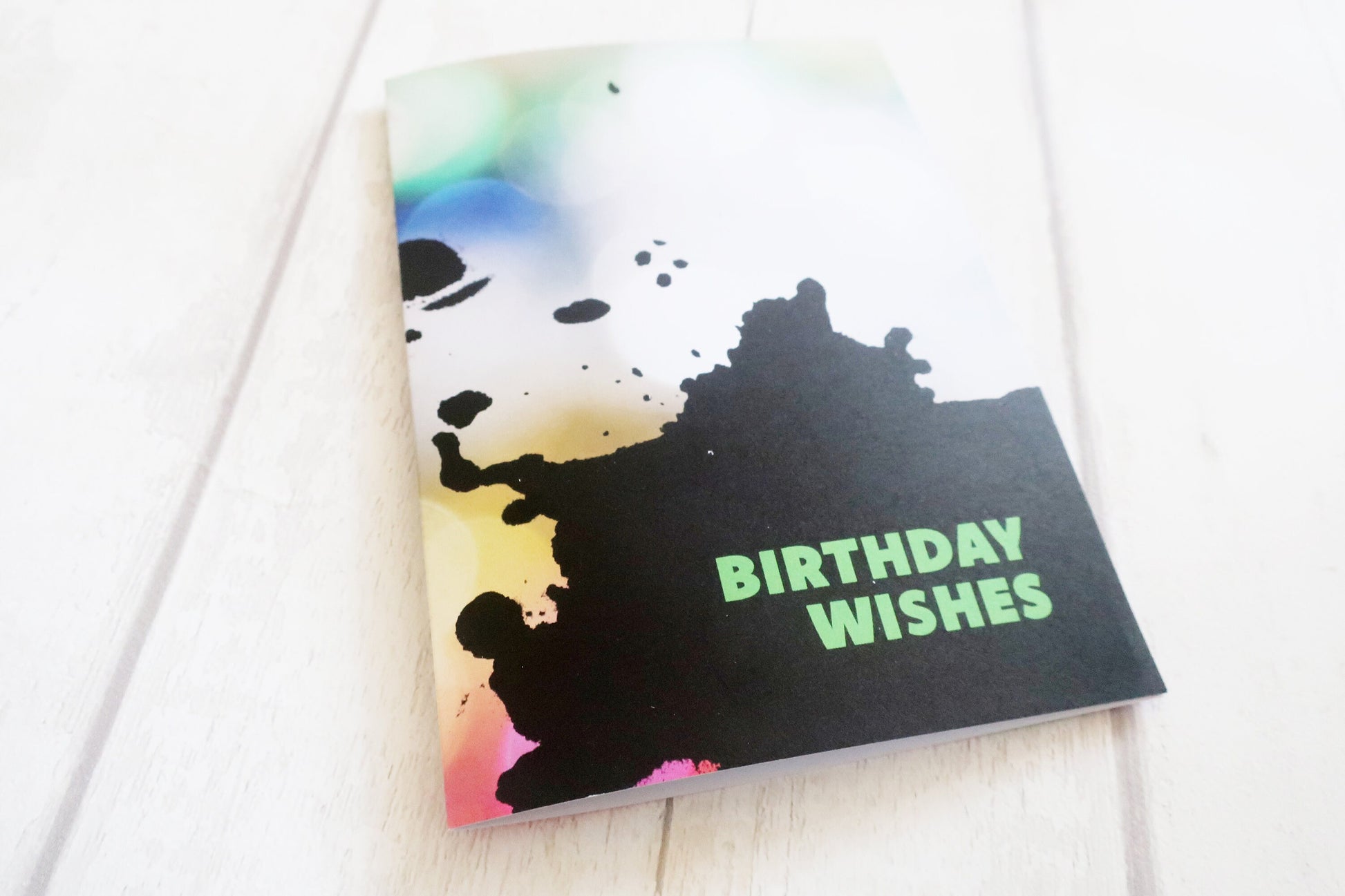 Greeting card with colorful design and 'Birthday Wishes' text on a white background