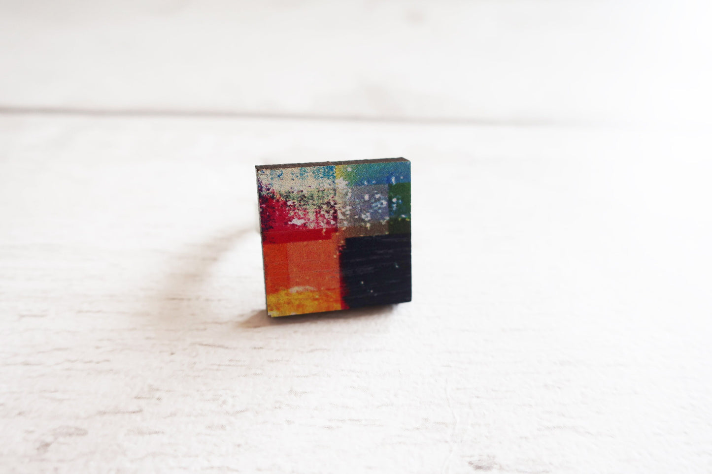 Colorful square ring on a white surface