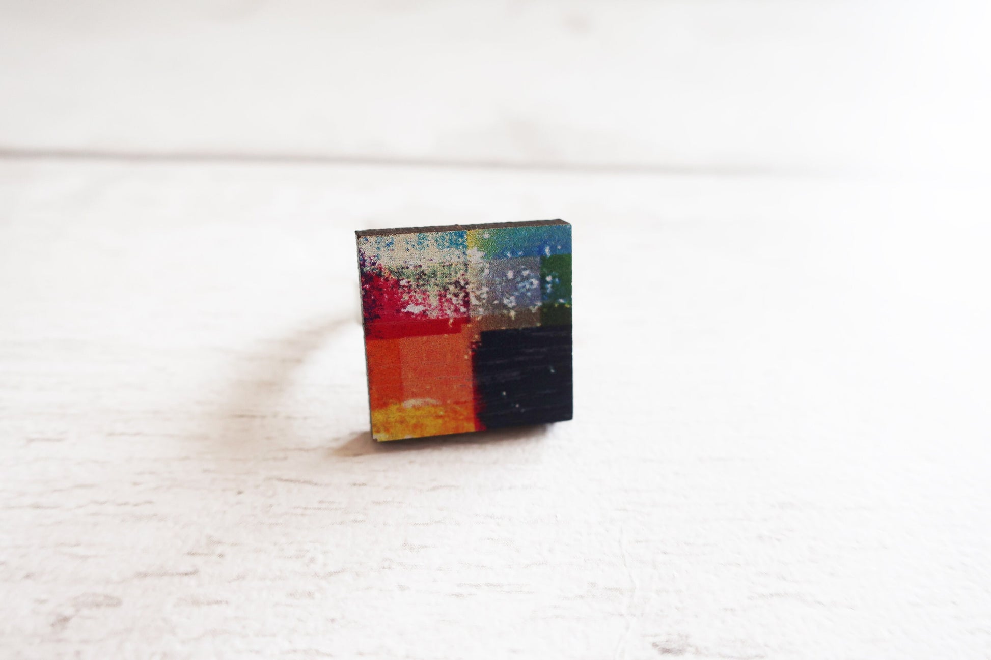 Colorful square ring on a white surface