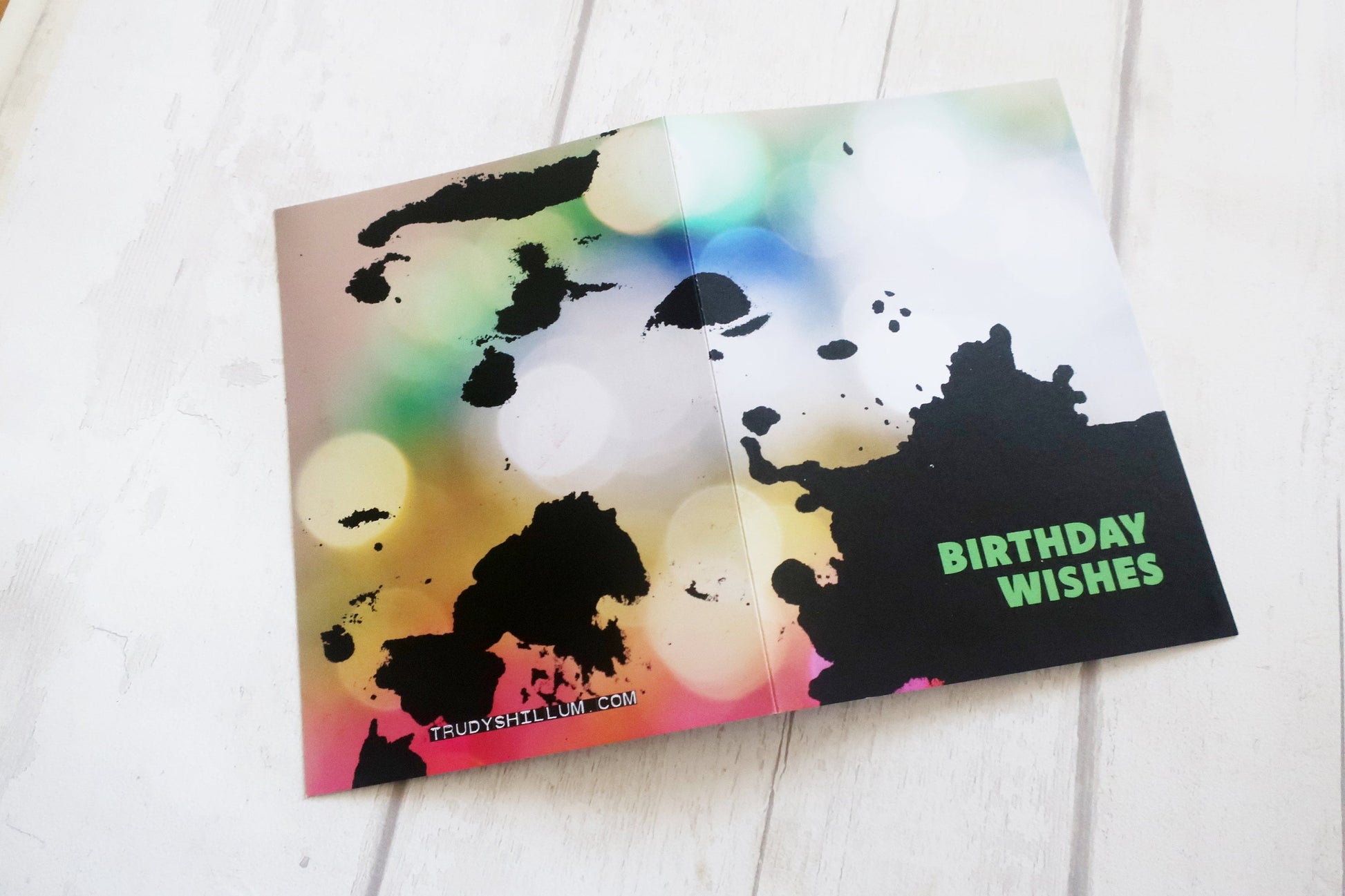 Colorful birthday card with black text on a white surface
