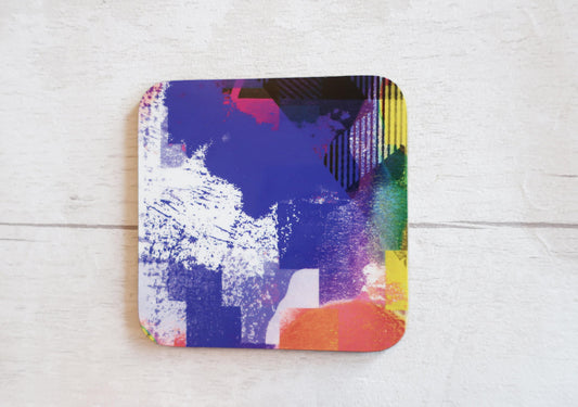 Colorful abstract coaster on a light wooden surface