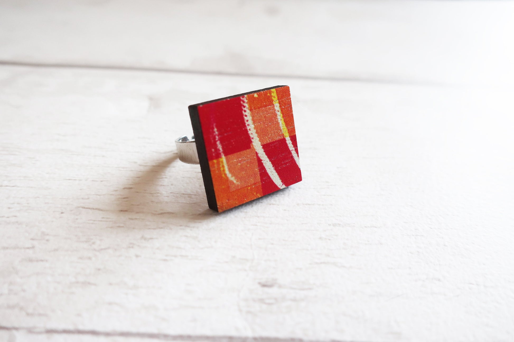 Colorful rectangular ring on a white surface