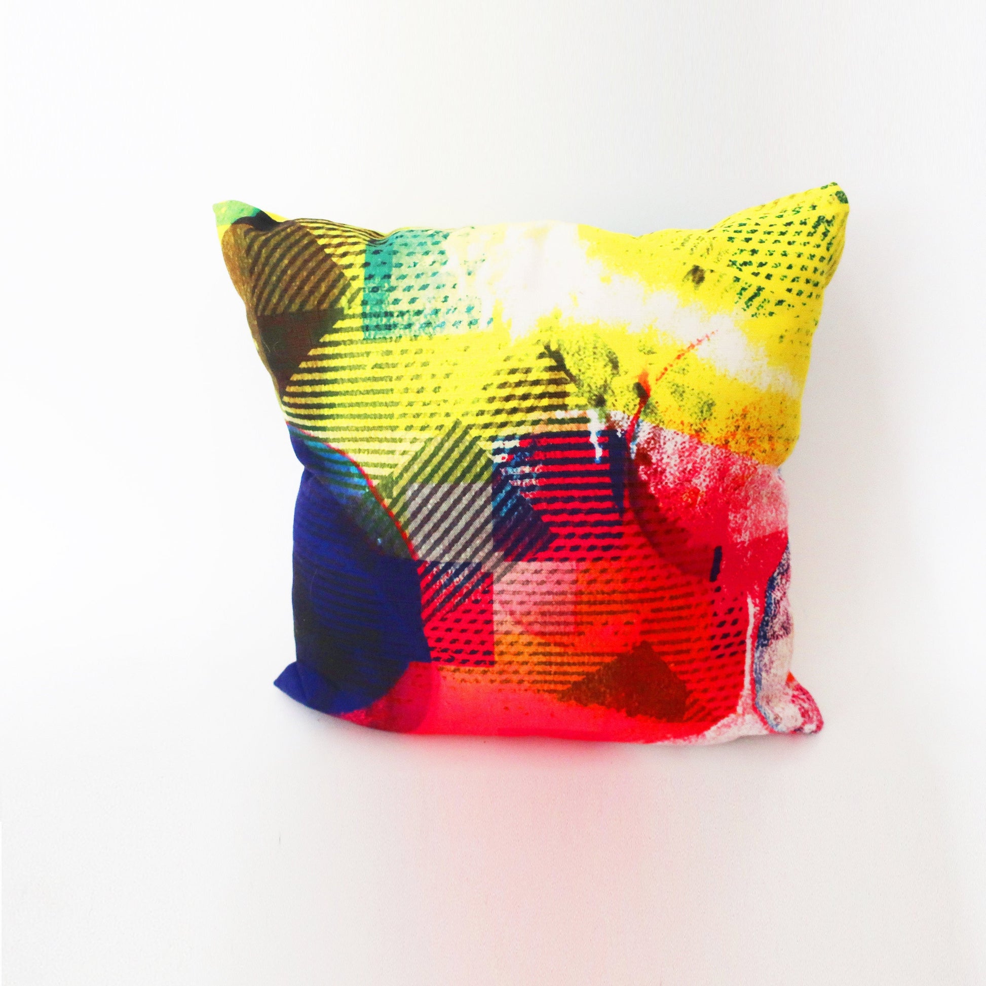 Colorful abstract-patterned pillow on a white background