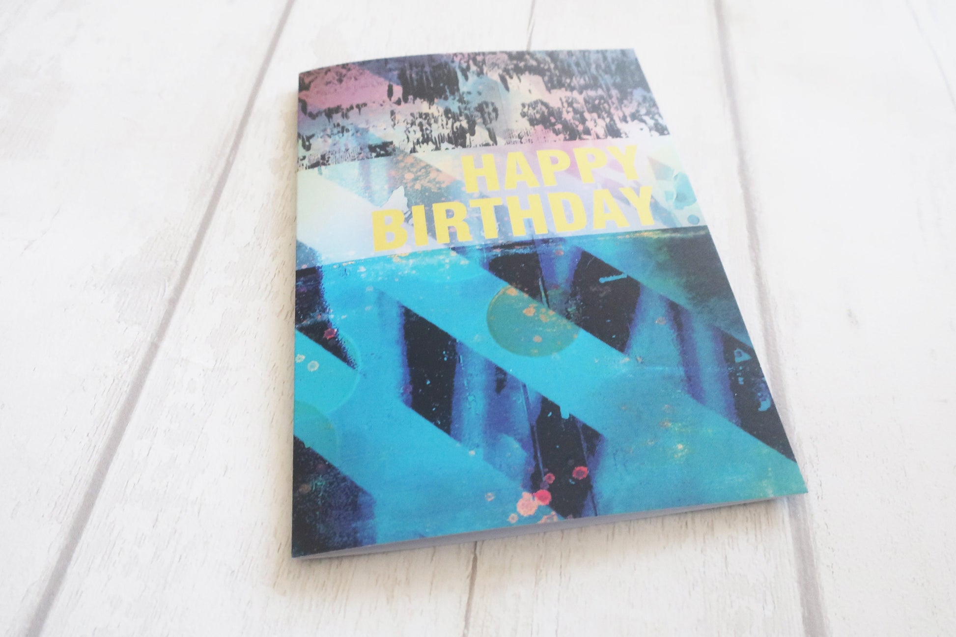 Colorful birthday card with abstract design on a white background
