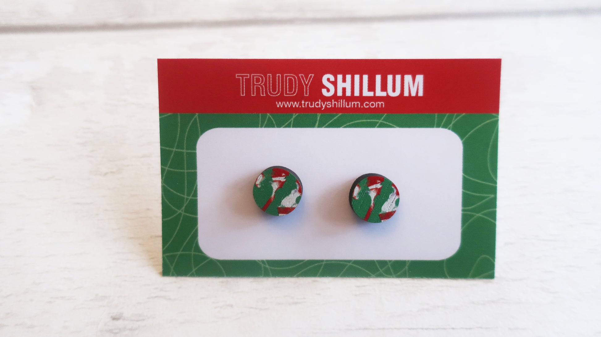 Pair of Christmas earrings on a branded backing card