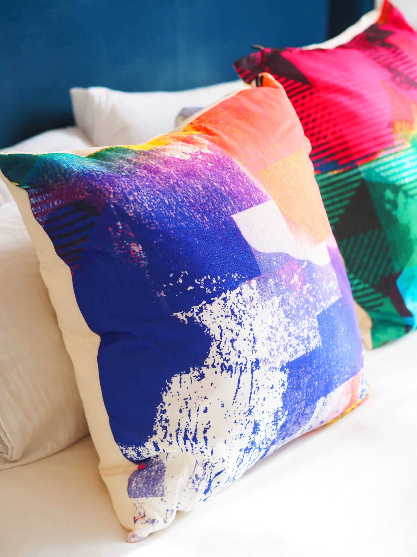 Colorful abstract-patterned pillows on a couch