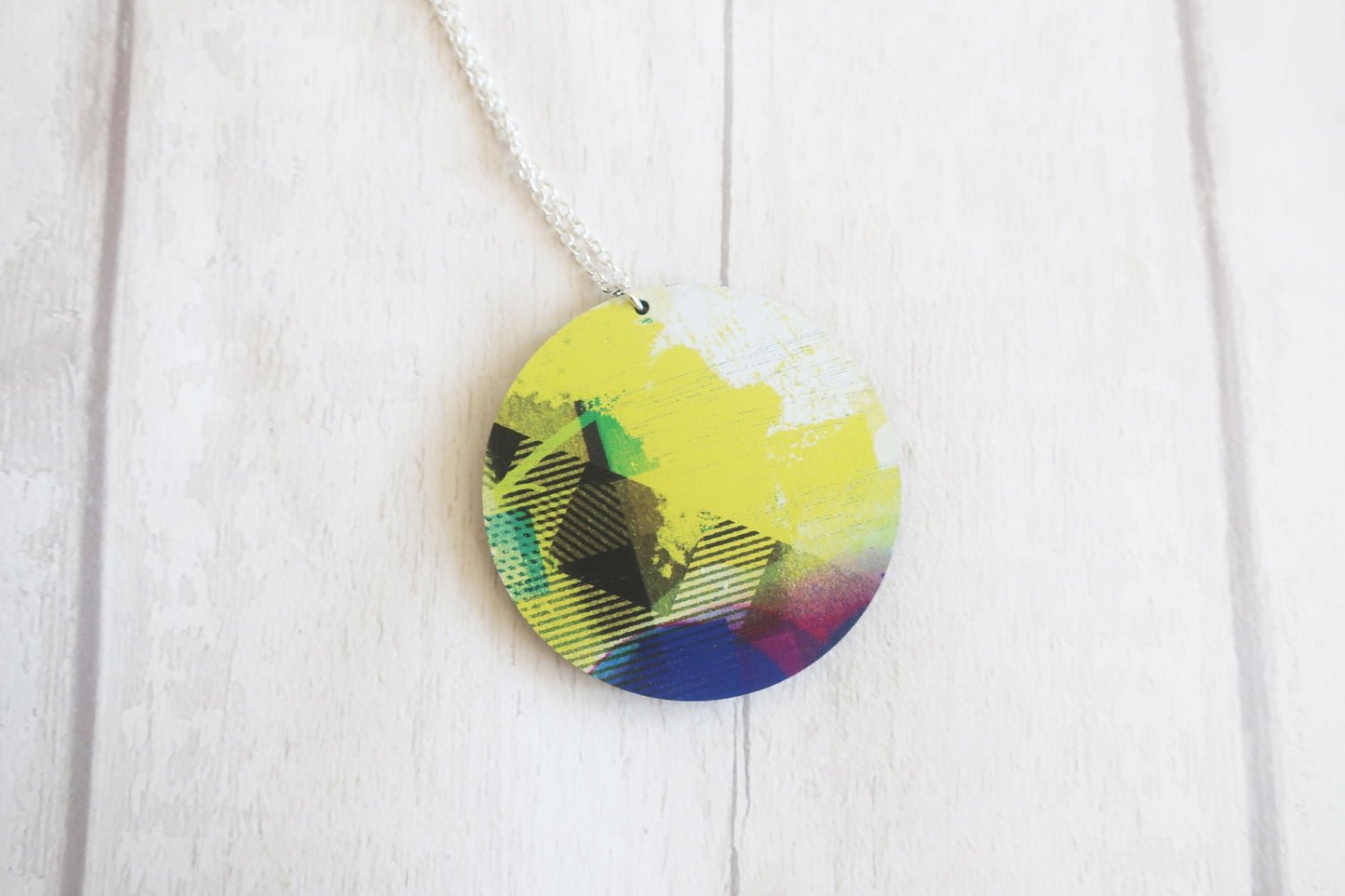 Colorful circular pendant on a white background
