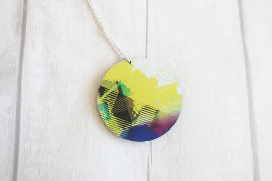 Colorful circular pendant on a white background