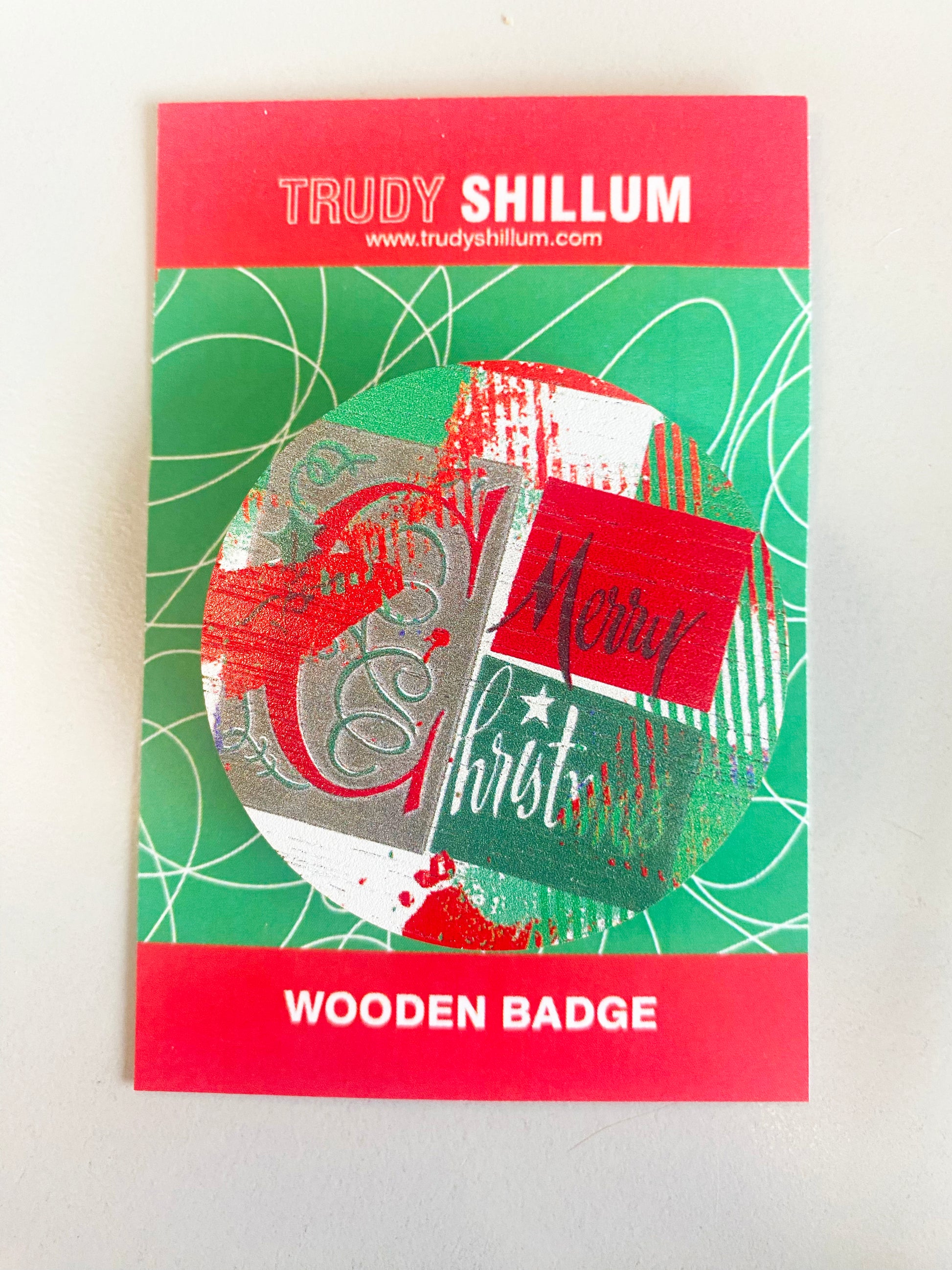 Christmas badge on backing card