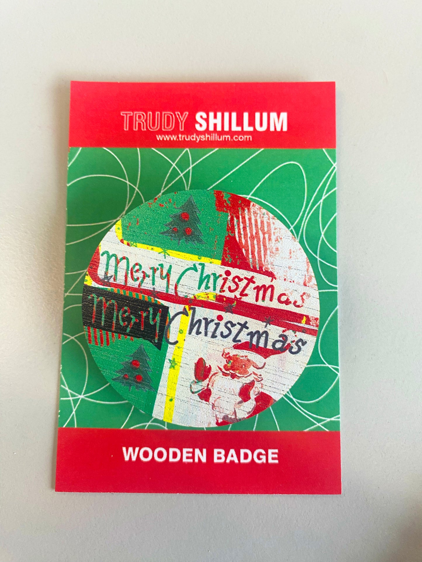 Christmas badge on backing card