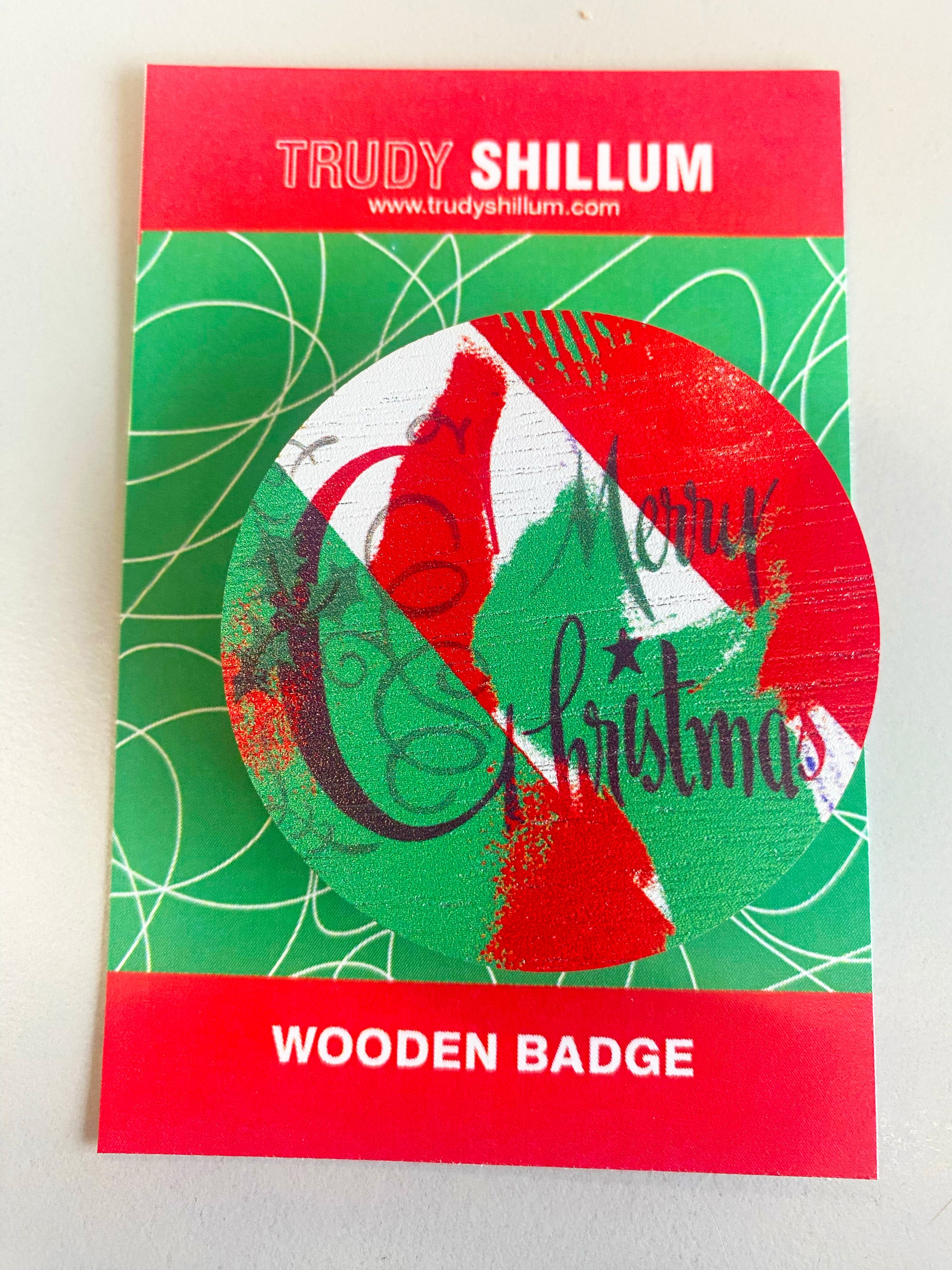 Christmas badge on backing card