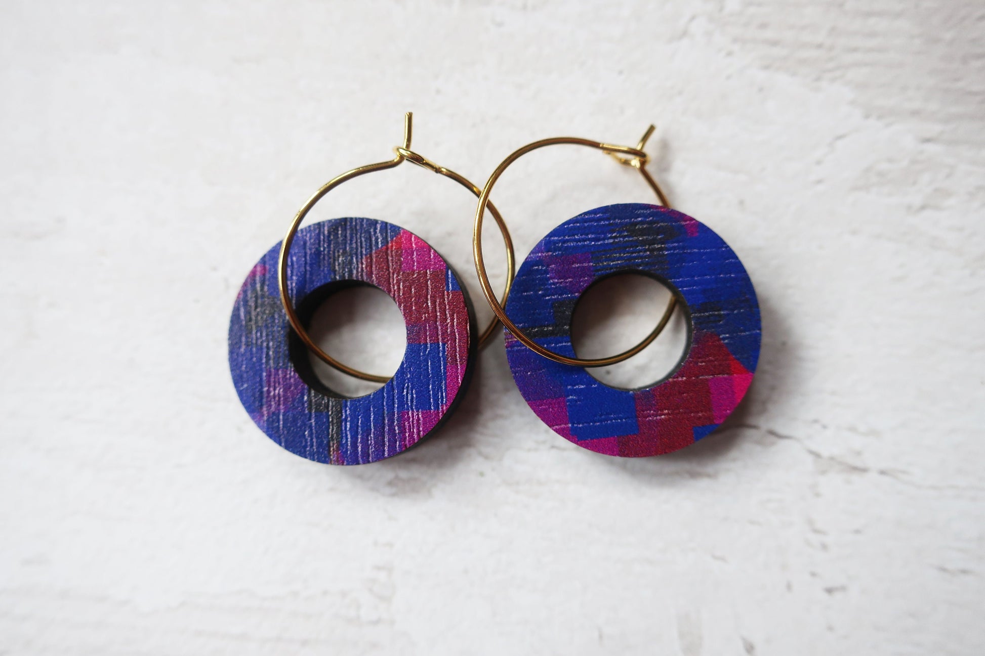 Colorful hoop earrings on a white background