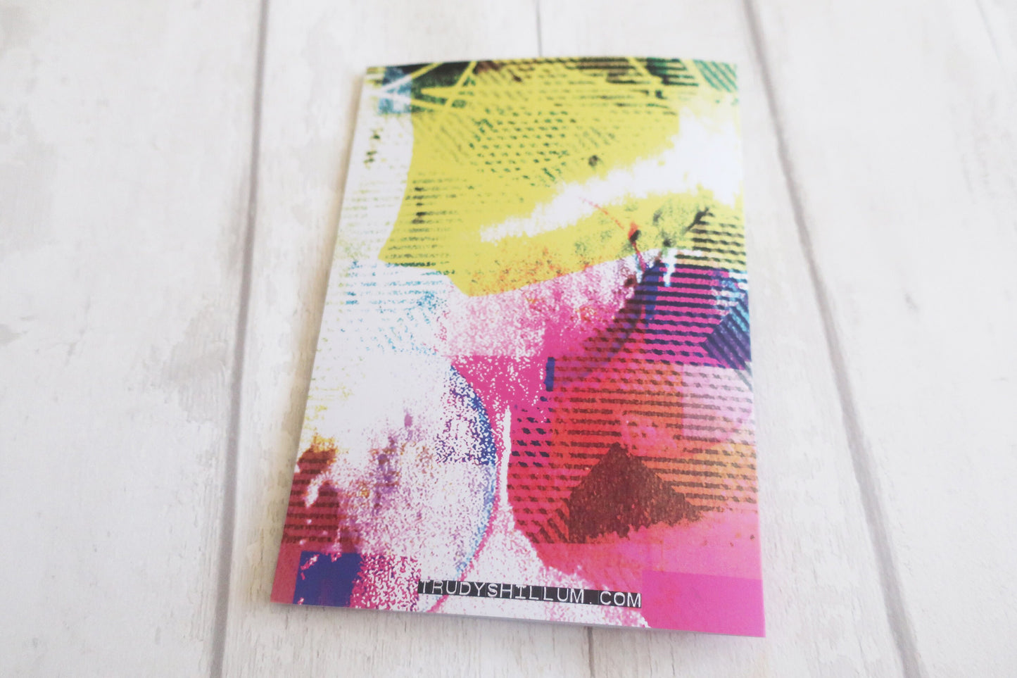 Colorful abstract card back on a white surface