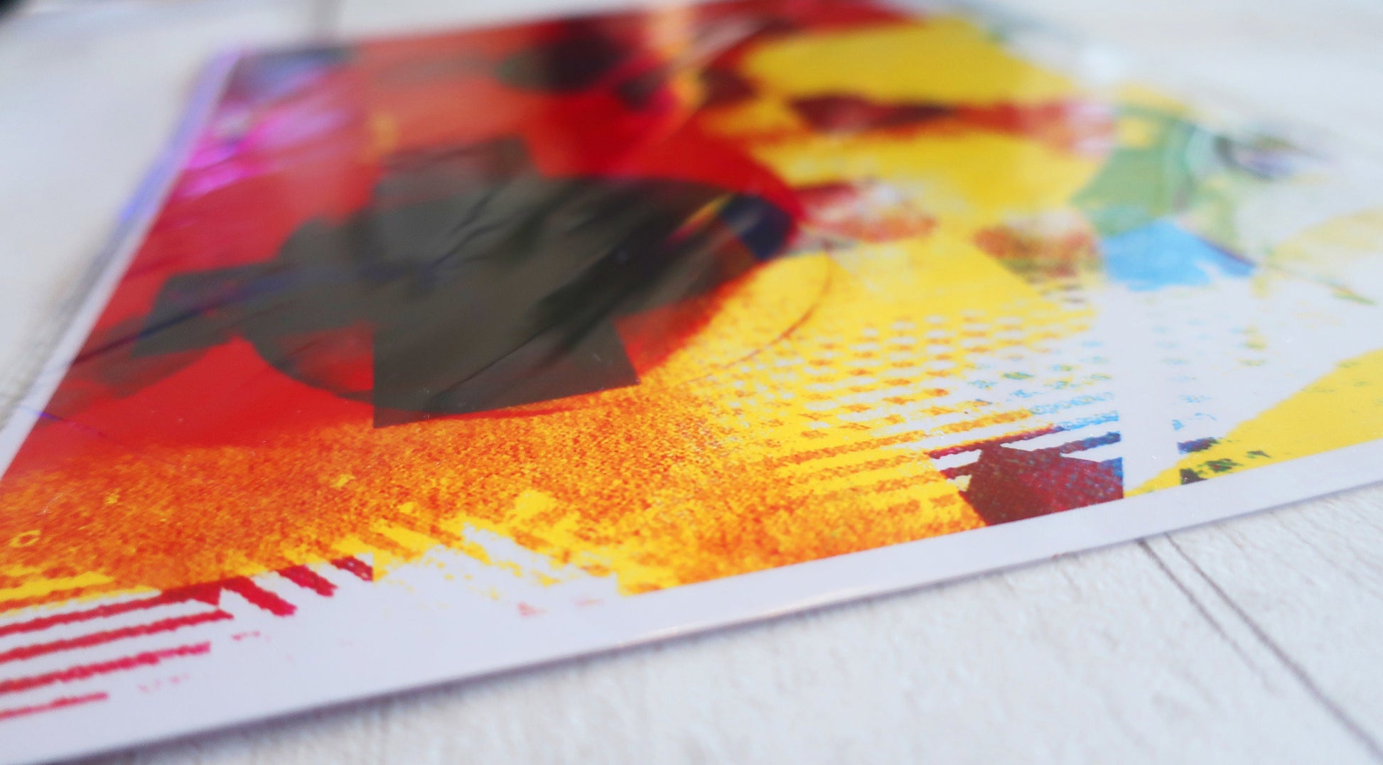 Colorful abstract A4 print  on a white surface