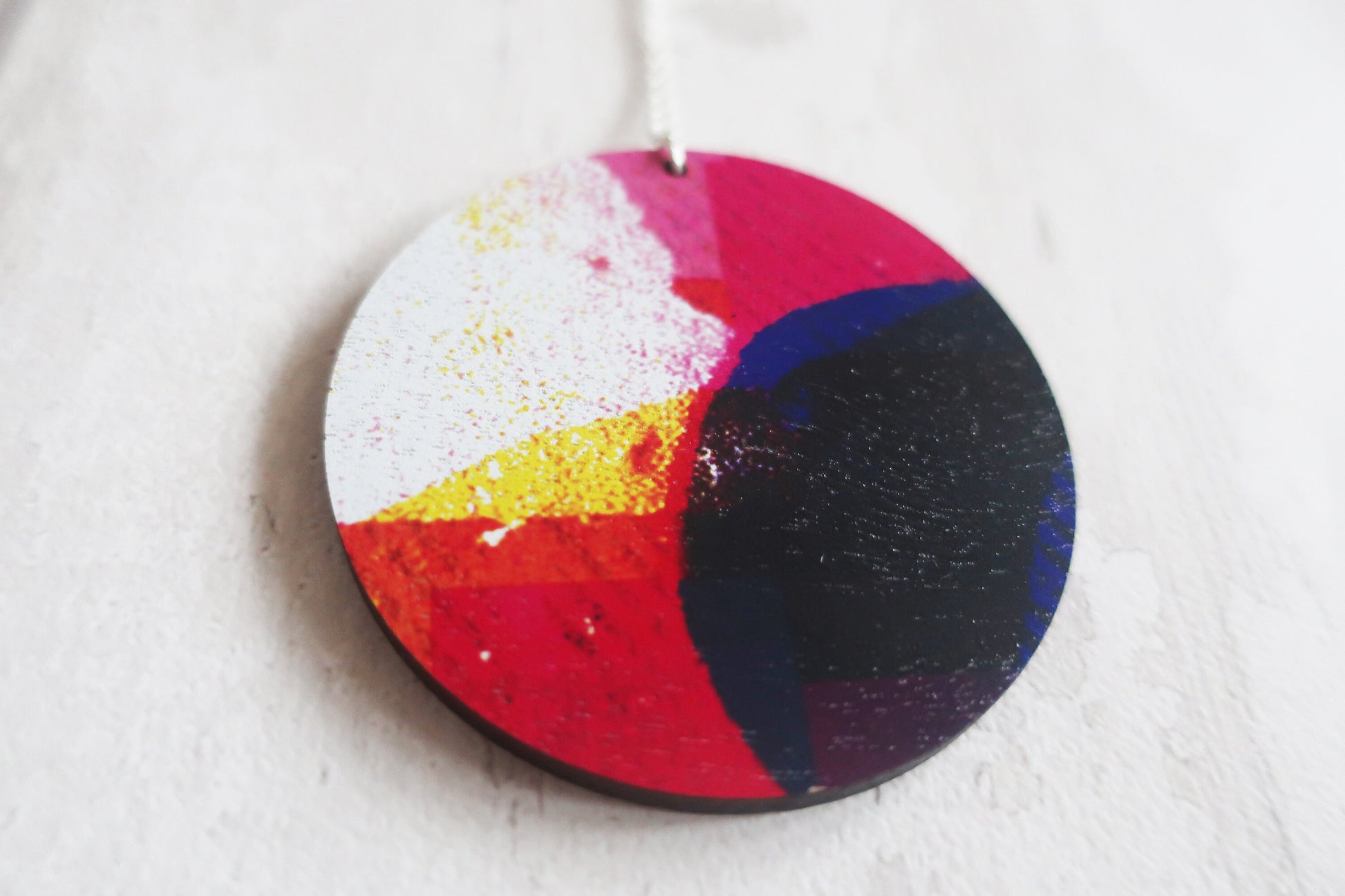 Colorful round pendant with a white background