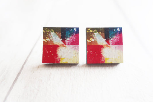 Pair of colorful square earrings on a white background
