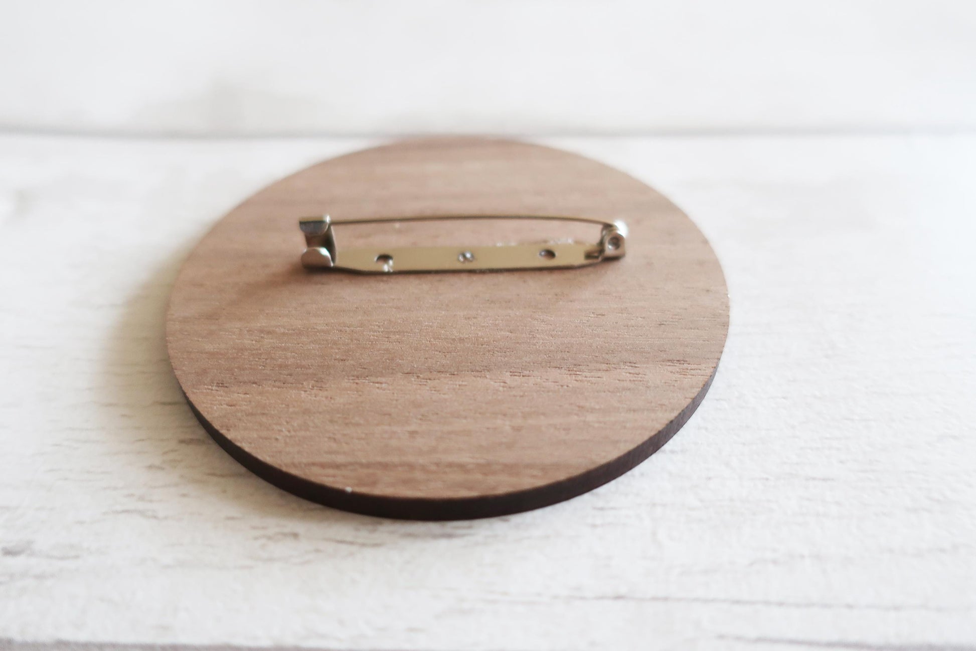 Wooden brooch back with silver clasp pin