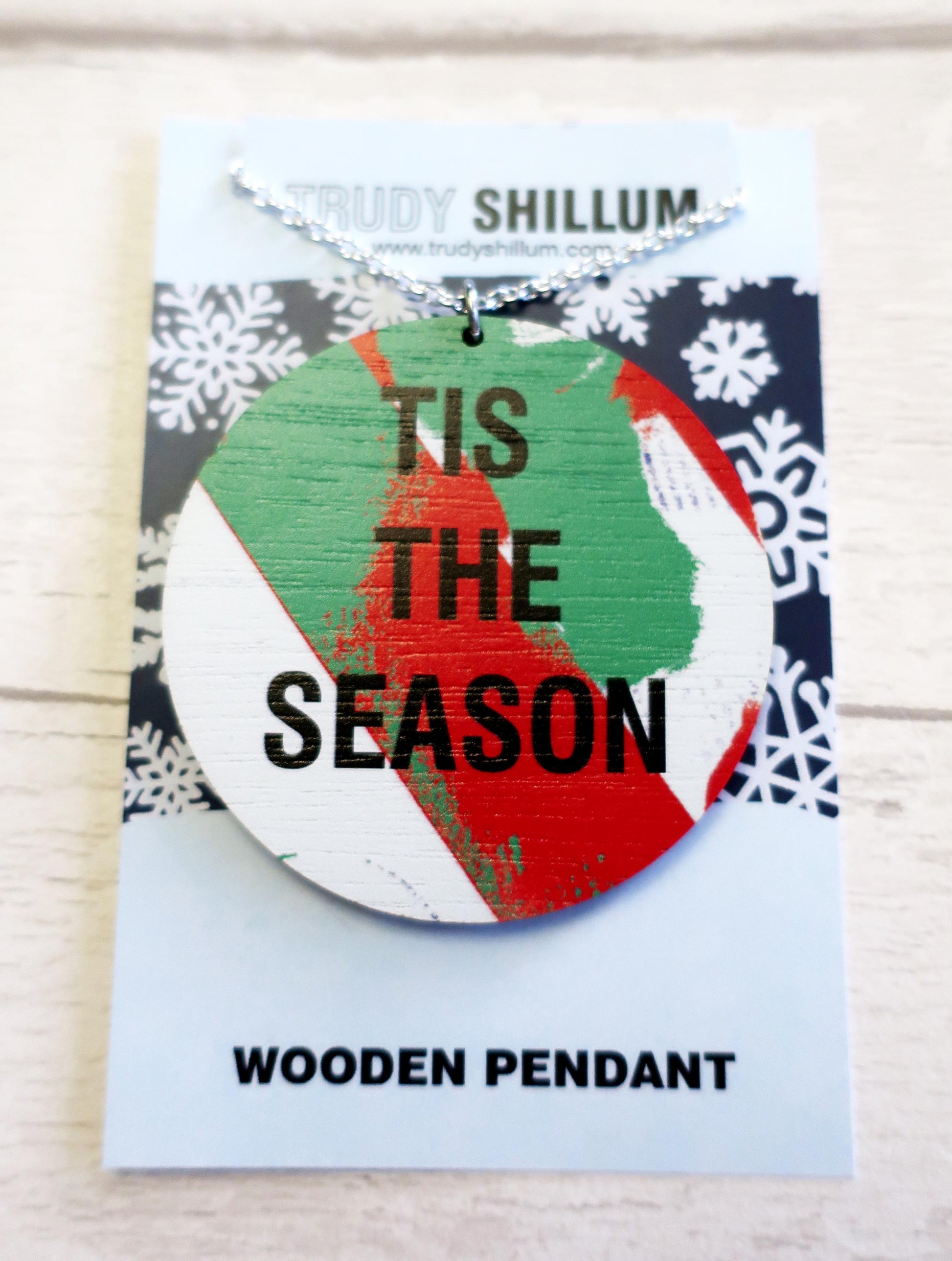 Wooden pendant with 'Tis the Season' text on a card with snowflake pattern