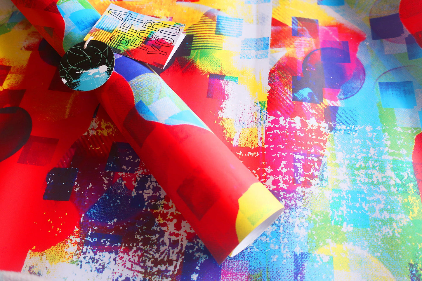 Colorful abstract paper with geometric patterns on a textured surface