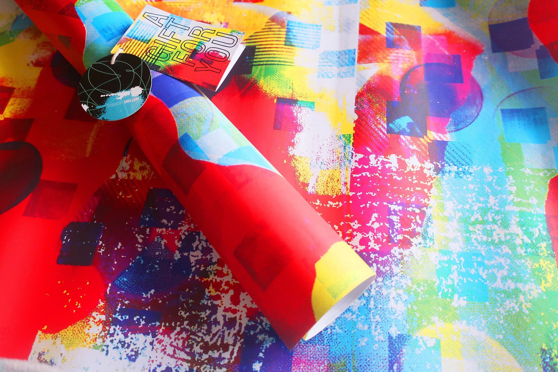 Colorful abstract paper with geometric patterns on a textured surface
