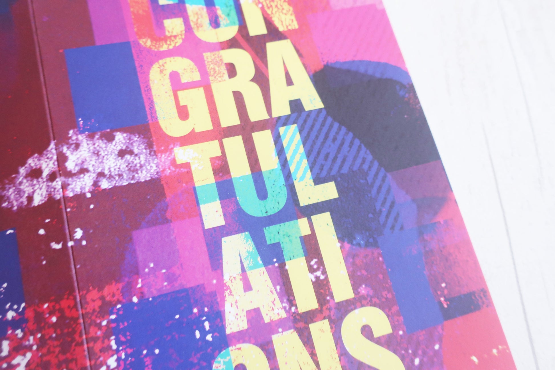 Colorful card with 'Congratulations' text on a patterned background