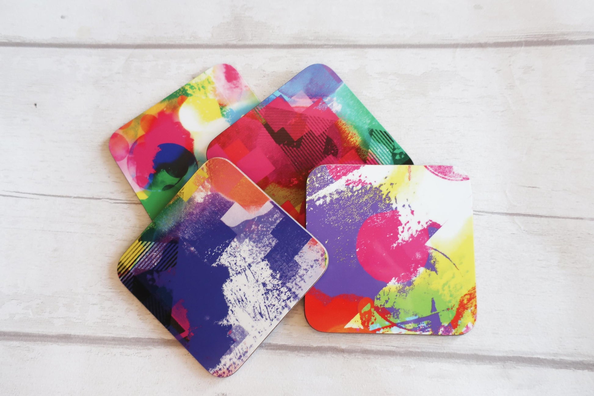 Set of colorful coasters on a wooden surface