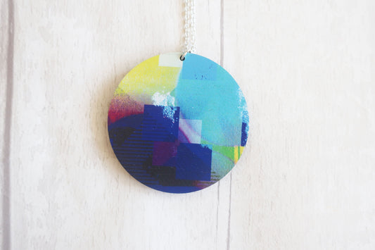 Colorful abstract pendant on a white background