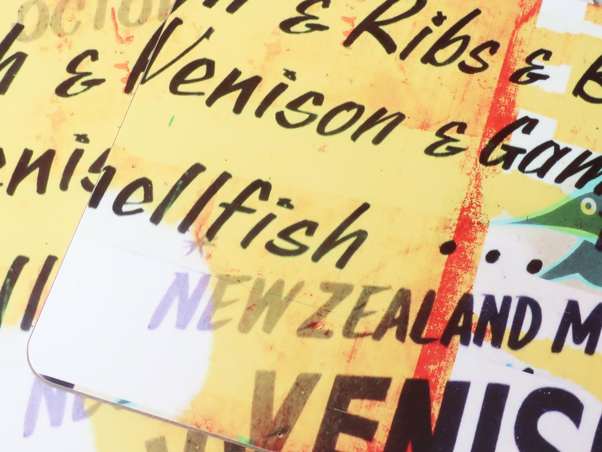 Close-up of a placemat  with text about New Zealand meat products on a yellow background.