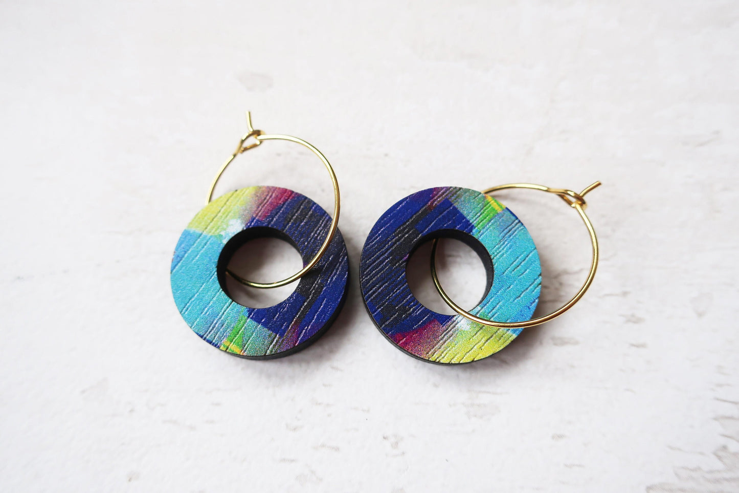 Colorful hoop earrings on a white background