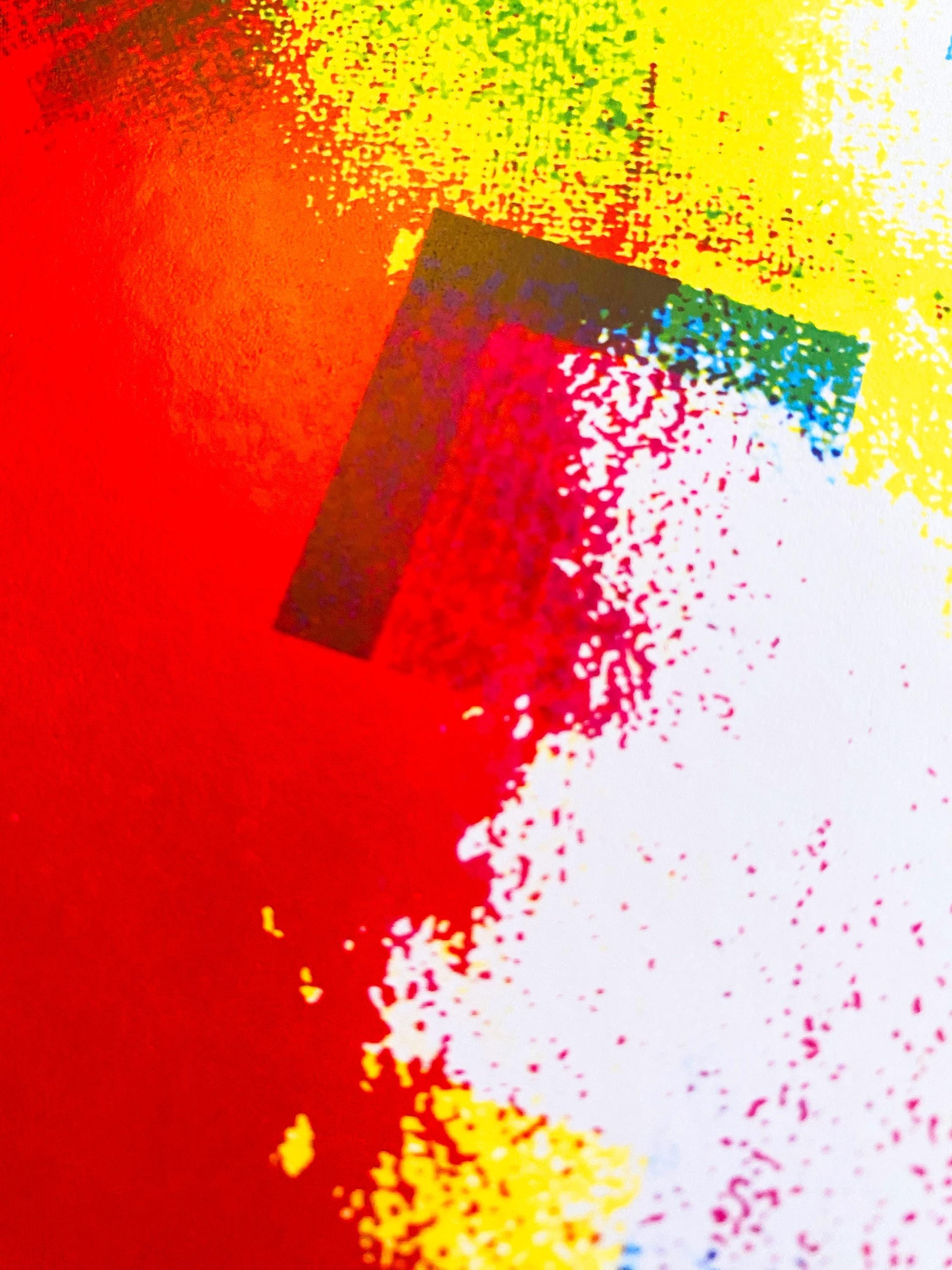Abstract art with splashes of red, yellow, and white on a textured background
