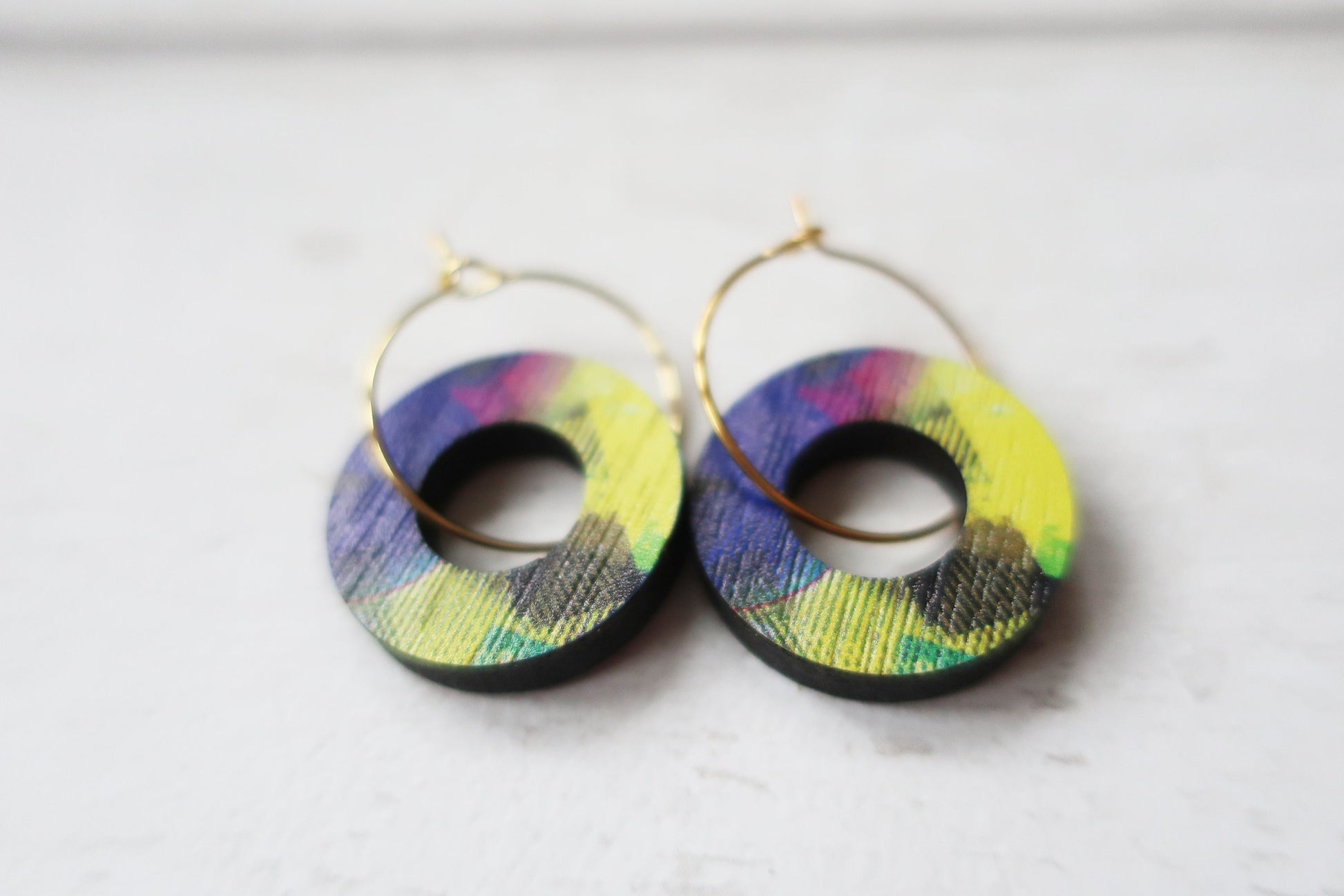 Colorful hoop earrings on a white background