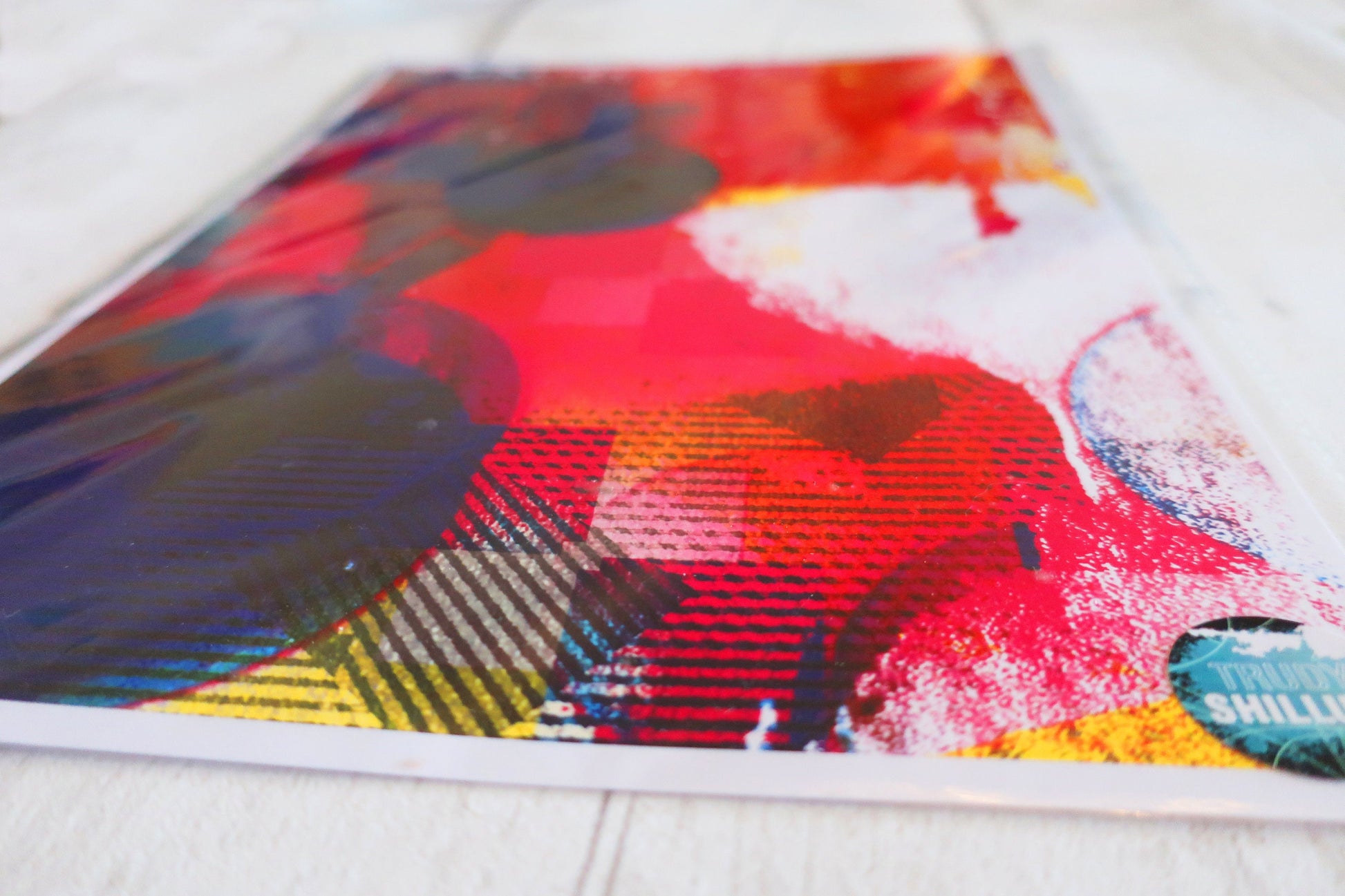 Colorful abstract art print on a white surface