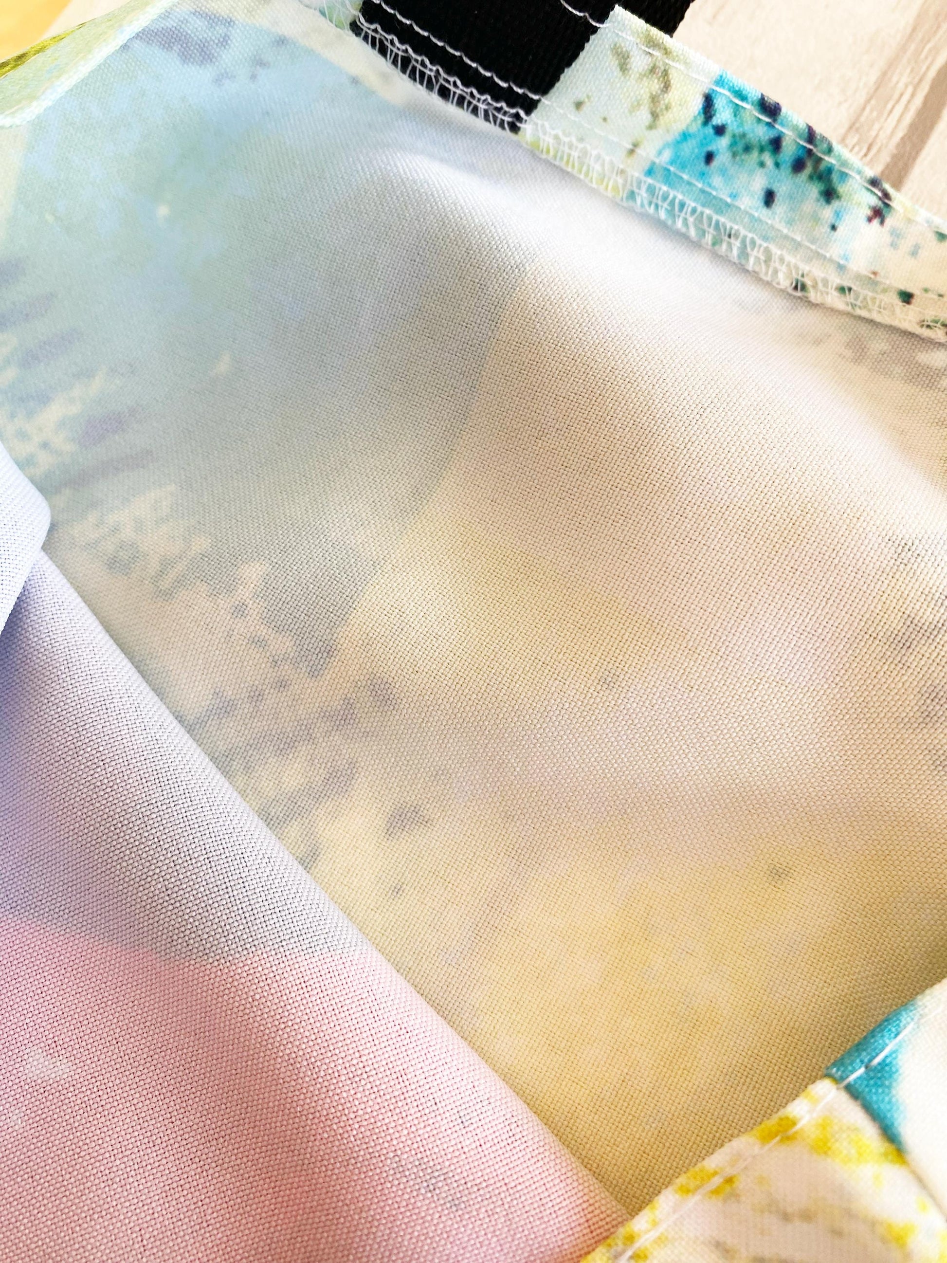 Close-up of fabric with a textured pattern on a wooden surface