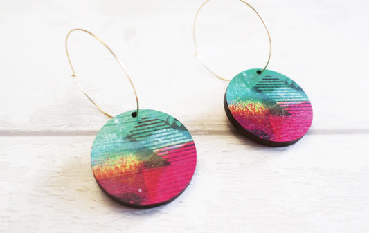 Colorful circular earrings on a white background