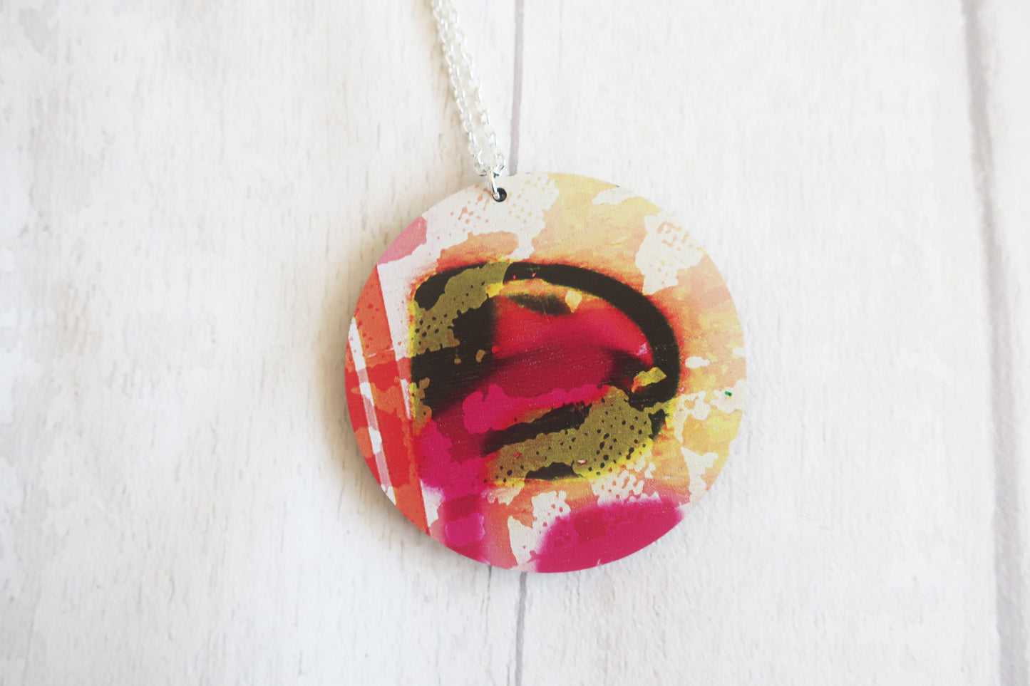 Colorful round pendant on a white background