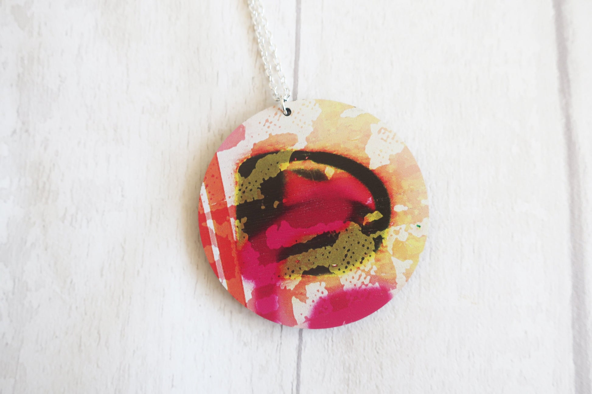 Colorful round pendant on a white background