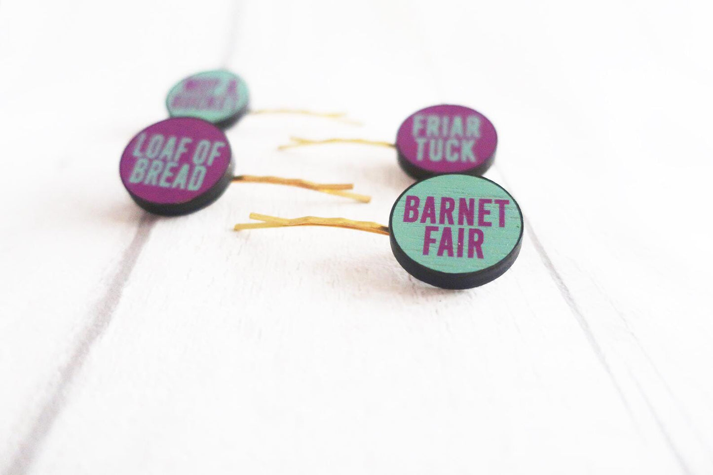 Set of hairpins with text on a white background