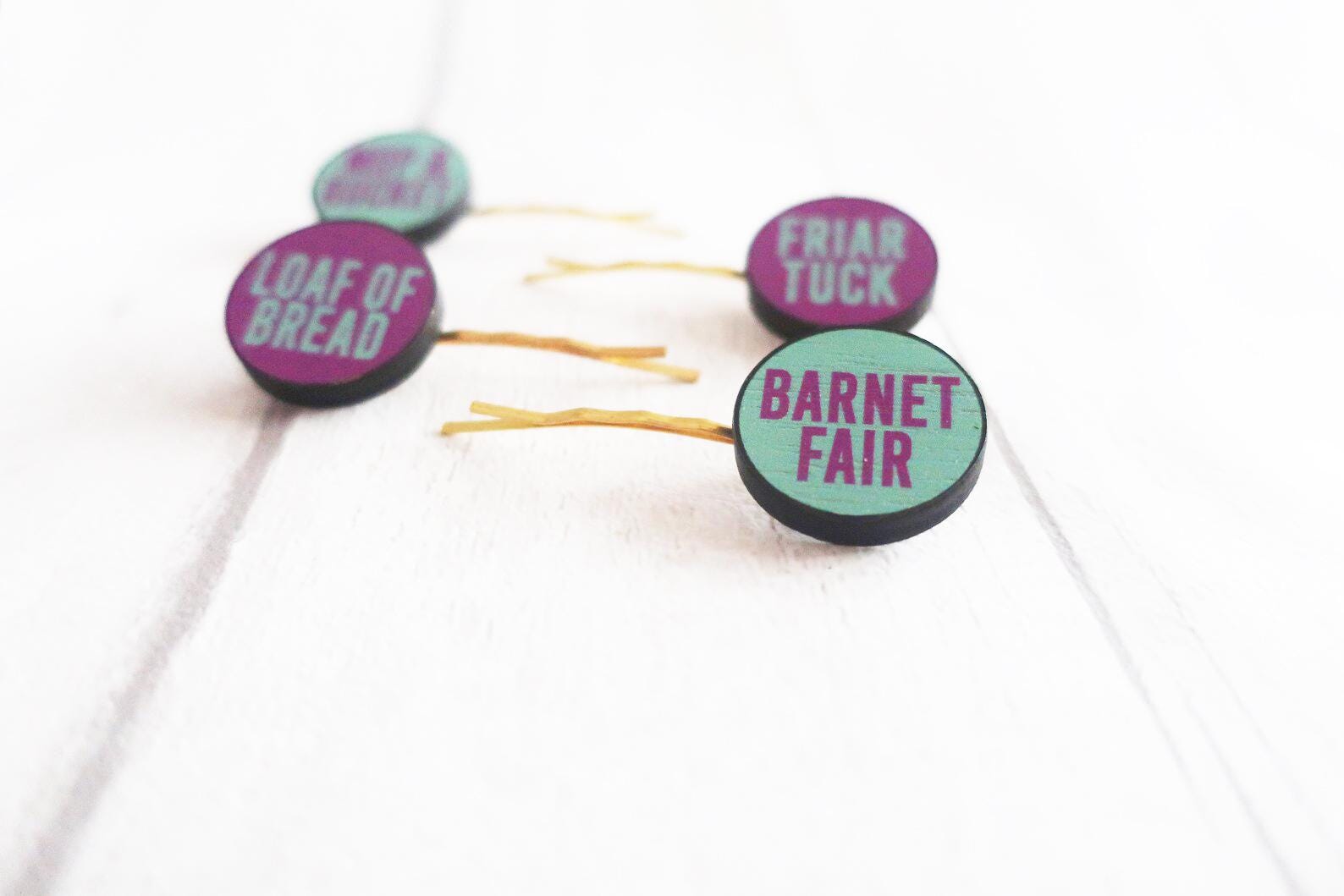 Set of hairpins with text on a white background
