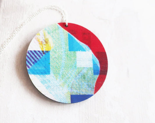 Round colorful pendant on a white background