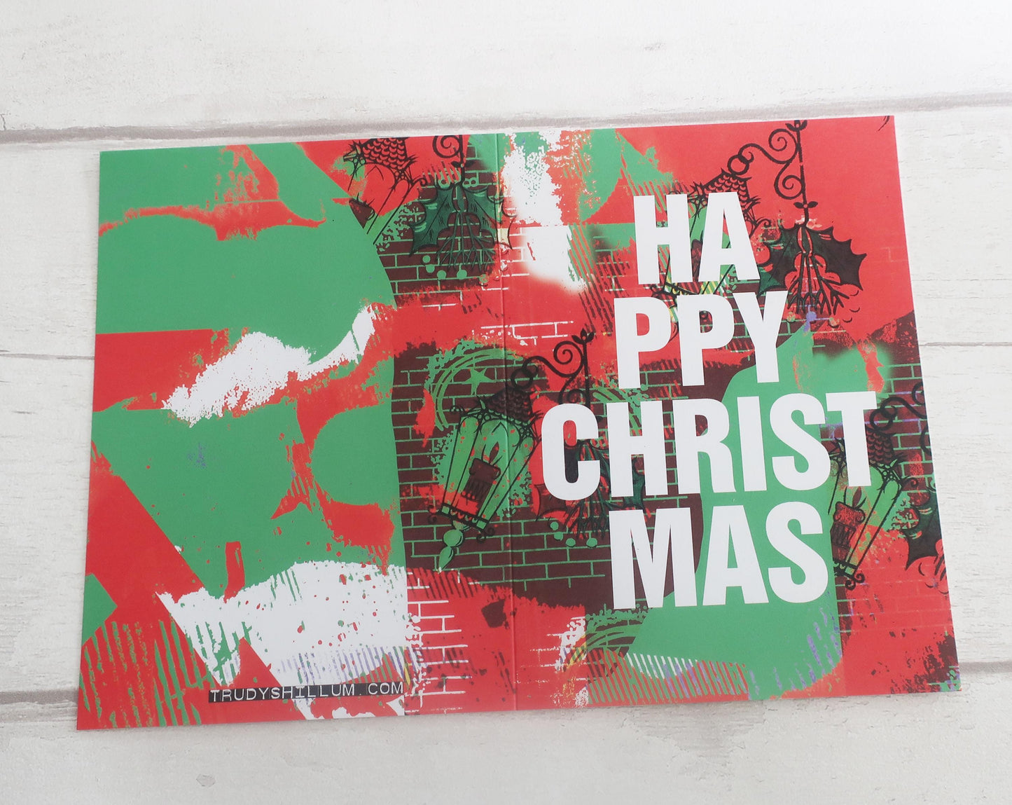Christmas-themed decorative card with 'Happy Christmas' text on a red and green background.
