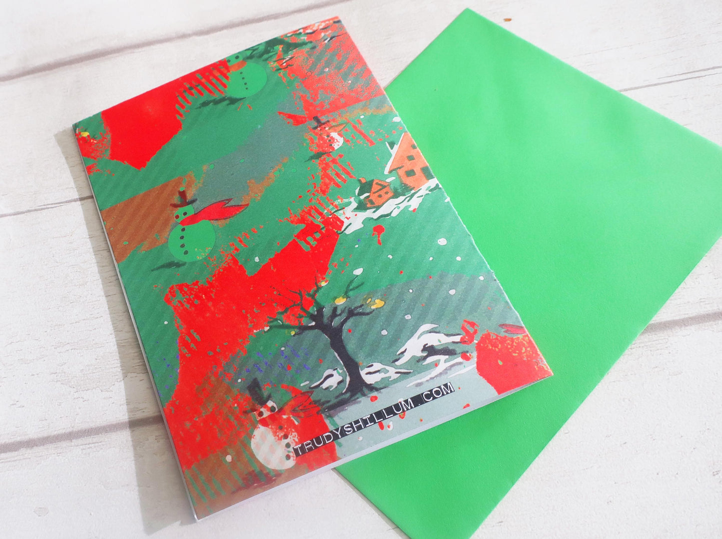 Colorful card with artistic design on a white surface