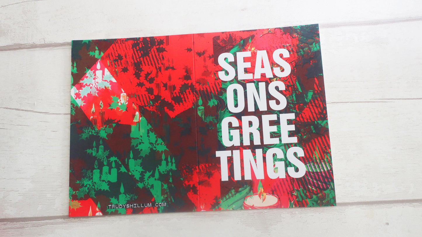 Christmas card with 'Seasons Greetings' text on a red and green patterned background.