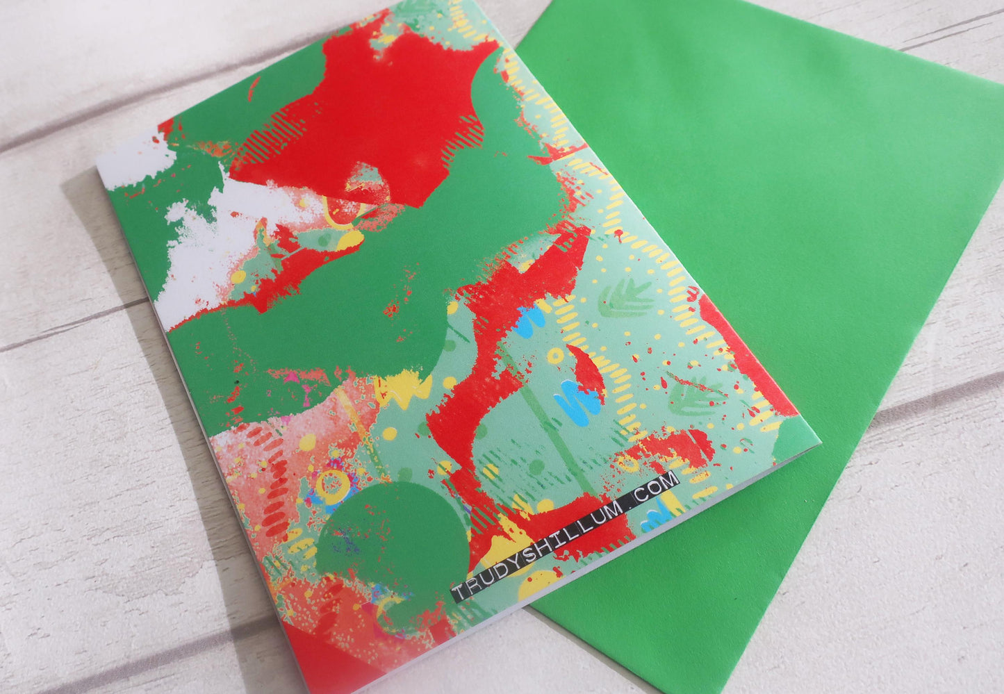 Colorful abstract card on a green envelope
