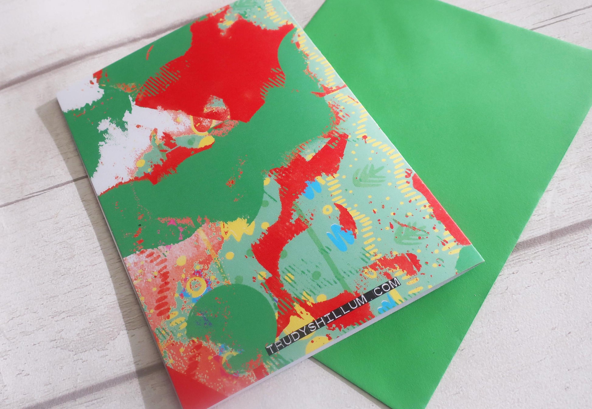 Colorful abstract card on a green envelope