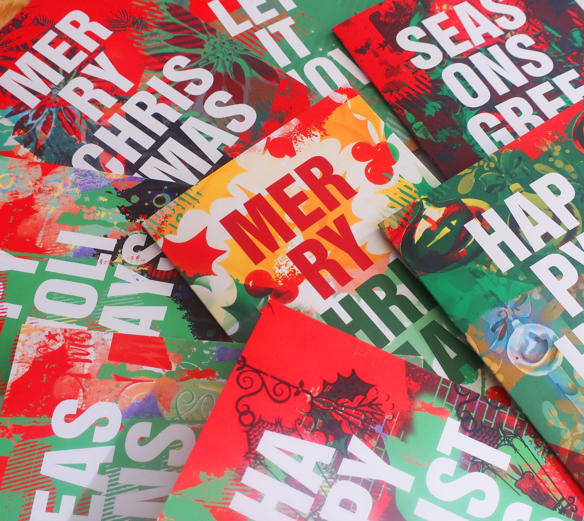 Collection of colorful Christmas cards with various designs and text.